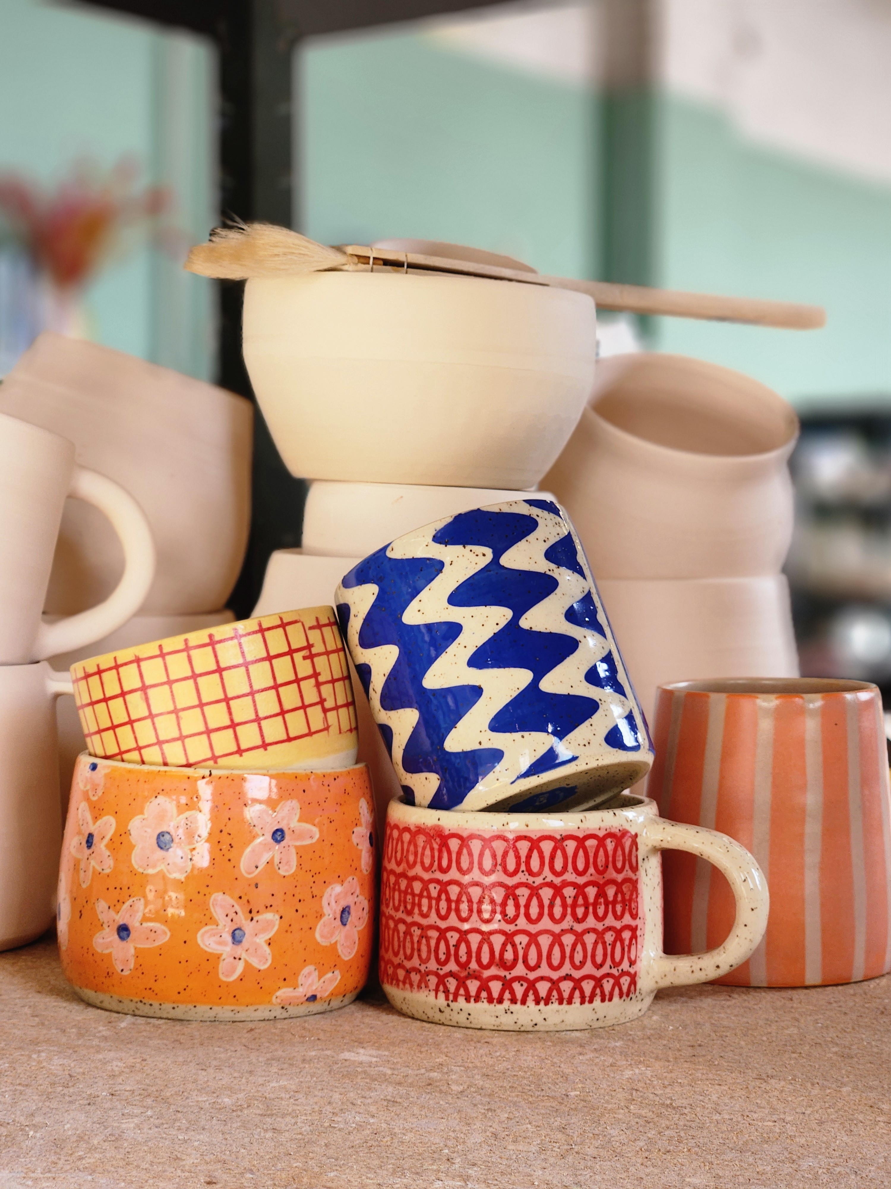 stack of ceramics on a shelf
